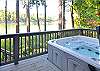Huge hot tub is off the master bedroom and has a view of the water.