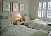 A twin-bedded guest bedroom in the Main House.