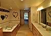 The spacious bath offers a jetted tub.