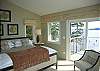 An upper bedroom with great view, great deck, great bed!