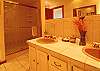 Master bath features dual vanities and large shower.