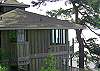 The two story home has decks on both levels; bedrooms both on the lower level.