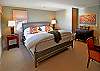 this bedroom also opens onto the deck and has mirrors to reflect the view.