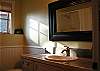 Lovely bathroom with tub/shower on the lower level.