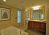 The master bath has both a soaking tub and walk-in shower.