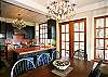 Dining for eight with a view of the sound by day and the sparkle of cut glass chandeliers.