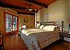 beautiful woods and decks of the main level master bedroom