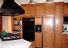 Kitchen has a double oven, built-in cooktop with expansive counters, and other upscale amenities for the gourmet cook.