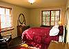 Relax in this beautifuly furnished guest bedroom with double bed and antiques.