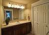 One of the upper master bathrooms. All baths have large tiled stall showers.