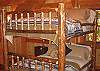 A second guest bedroom offers a second set of queen bunk beds.