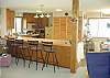Kitchen offers bar seating.