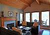The comfy seating area by the fire. The great rooms opens to the deck.