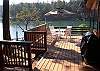 Enjoy a BBQ on this expansive wrap around deck with easy access to the boat dock.