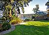 Wonderful grassy yard slopes down to the water.