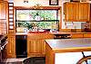 This convenient kitchen has a garden window at the sink, coffee maker, dishwasher, blender, toaster, and microwave.