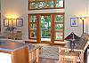 Living and dining area. The futon folds into a large twin bed.