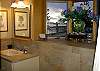 The bathroom on the lower level is beautifully tiled and roomy, with walk in shower.