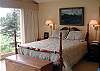 The master bedroom is on the main level. Master bath includes a large dressing area, spacious closets, double sink vanity, and large soaking tub.