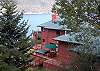 Built in to the hillside, this two story home hugs the slope. Enjoy multiple decks for dining, viewing, soaking in the hot tub!