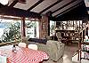 Casual dining and seating area by the wood stove.