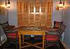 The foyer of the the Paddock offers a game table, window seat and refrigerator.