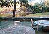 The massive bluestone patio overlooks the fishing lake, spring fed and stocked with rainbow trout.