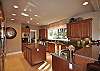 Kitchen has 2 ovens, 2 DW; a butler's pantry is adjacent.