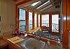 The master vanity has a view through the sunroom!