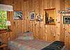 Two twin beds are in a bedroom just off the living room.