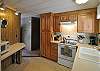 Kitchen is meticulous and well-equipped.