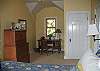 Spacious master bedroom with king bed has views across to MacKaye Harbor.