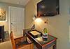 The writing desk and HDTV in the west bedroom.