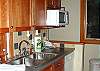The galley kitchen at Madrona House features a work island.