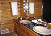 The master bath has a double sink vanity and separate shower.