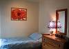 The second bedroom has twin beds and is intended as a childrens room.