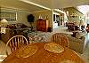 Open living and dining with game nook.