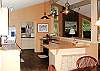 The roomy kitchen iis the center of the home and offers many amentities including extra pantry, cookbooks, and a breadmaker.
