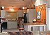 Kitchen opens to living room.