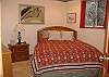 Queen bed in the lower guest room.
