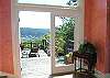 Enter the colorful foyer of this friendly home to find double doors that open directly to the large private deck.