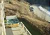 The hot tub is located off the lower level, overlooking the straits.