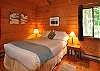 A queen size bedroom on the lower level.