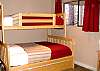 Bunk beds are located in a second lower level bedroom. This set has a twin upper bunk, double lower bunk, &amp; trundle below.