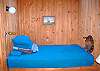 The window seat in the living room is a built in full size bed.