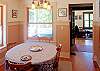 Dining area adjoins entry with access to outdoor deck &  BBQ.