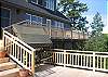 A BBQ is located just outside the kitchen door on the upper deck, making it easy to create a picnic to enjoy on the extensive brand new deck.