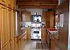 Bright and airy kitchen has ample cabinet and counter space