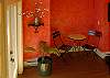 A cafe table in the foyer provides a central location for a game of cards or a sunny morning cup of coffee.