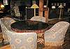An antique game table sits under 26 foot high ceilings of the restored eighteenth century barn.